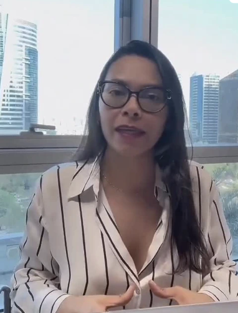 Lina Varon speaking in an office setting